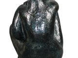 statue of a seated man on a black marble base