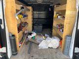the back of a van with a bunch of items in the back