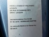 a label on the side of a bottle of liquid
