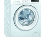 gros plan d'une machine à laver sur fond blanc