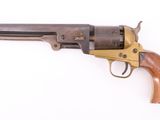 an old revolver on a white background with a wooden handle