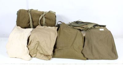 several bags are lined up on a white surface with a white background