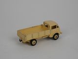 a toy truck that is sitting on a white surface