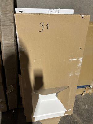 a cardboard box sitting on top of a box with a number on it