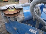 an image of a machine with a hose attached to it ' s side