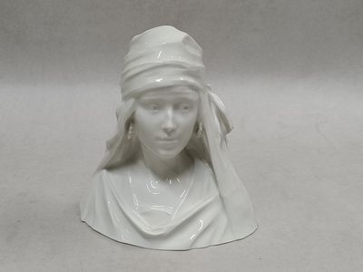 a white statue of a woman with a veil on her head