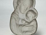 statue of a woman holding a child in her arms