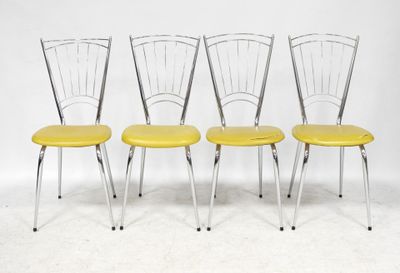 four yellow chairs with metal legs and a yellow seat