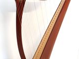 a large wooden harp sitting on a stand in a room