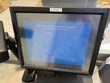 a computer monitor sitting on top of a counter