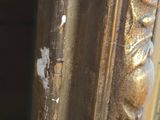 a close up of a mirror with peeling paint on it