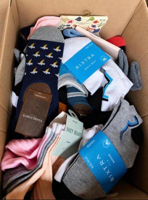 a box full of socks and a book in it