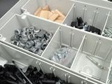 a box full of screws and nuts in it