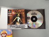 a video game on the table next to a cd