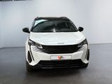 the front of a white car in a showroom with white walls
