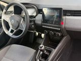 the interior of a car with a steering wheel, dashboard and dashboard controls