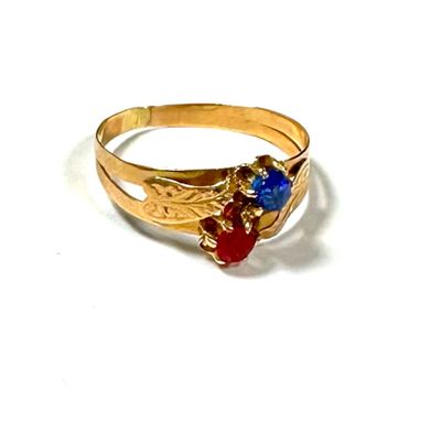 an image of a gold ring with blue and red stones on it