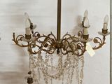 a chandelier hanging from the ceiling in a room