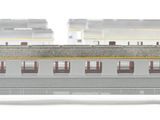 two trains that are sitting side by side on the tracks