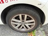 a close up of a white car with a red sticker on the side of it