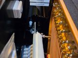 a close up of a piano with a label on it
