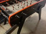 a foosball table in the middle of a room
