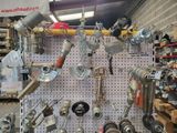 many different types of tools hanging on the wall