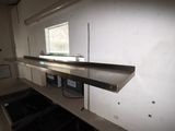 an image of a kitchen with a sink and a microwave