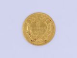 an image of a gold coin sitting on top of a white surface