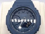 casio g - shock watch with blue rubber band and black face
