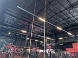 a gym with a lot of equipment in the room