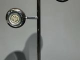 a lamp that is sitting on a stand on a table