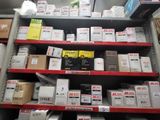 many boxes and packages on the shelves in the store