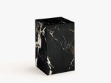 a black and white marble block on a white background