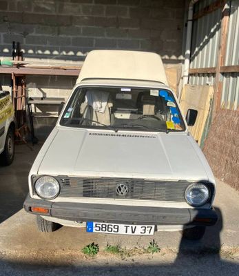 a white car that is parked in a garage