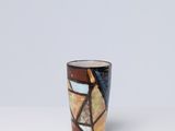 a small cup that is sitting on a table
