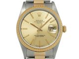 a gold and silver rolex watch with roman numerals