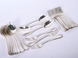 a lot of silver spoons and forks on the table