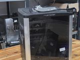 a microwave sitting on a wooden table in a kitchen