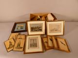 a lot of framed pictures on a white table
