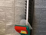 a picture of a green and red gas nozzler and a black and white gas nozzler and a green and red gas nozzler