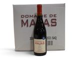 une bouteille de vin posée à côté d'une boîte