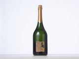 a bottle of wine that is sitting on a table