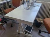 a sewing machine sitting on a table in a room