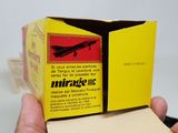 a small box with a picture of a plane inside of it