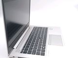 a laptop computer that is sitting on a white surface