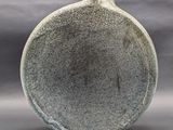 a picture of a vase that is sitting on a table
