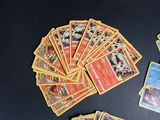 many pokemon cards laid out on a black table