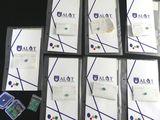 several folders of papers are sitting on top of a black table