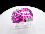 an image of a pink and white diamond ring on a white surface